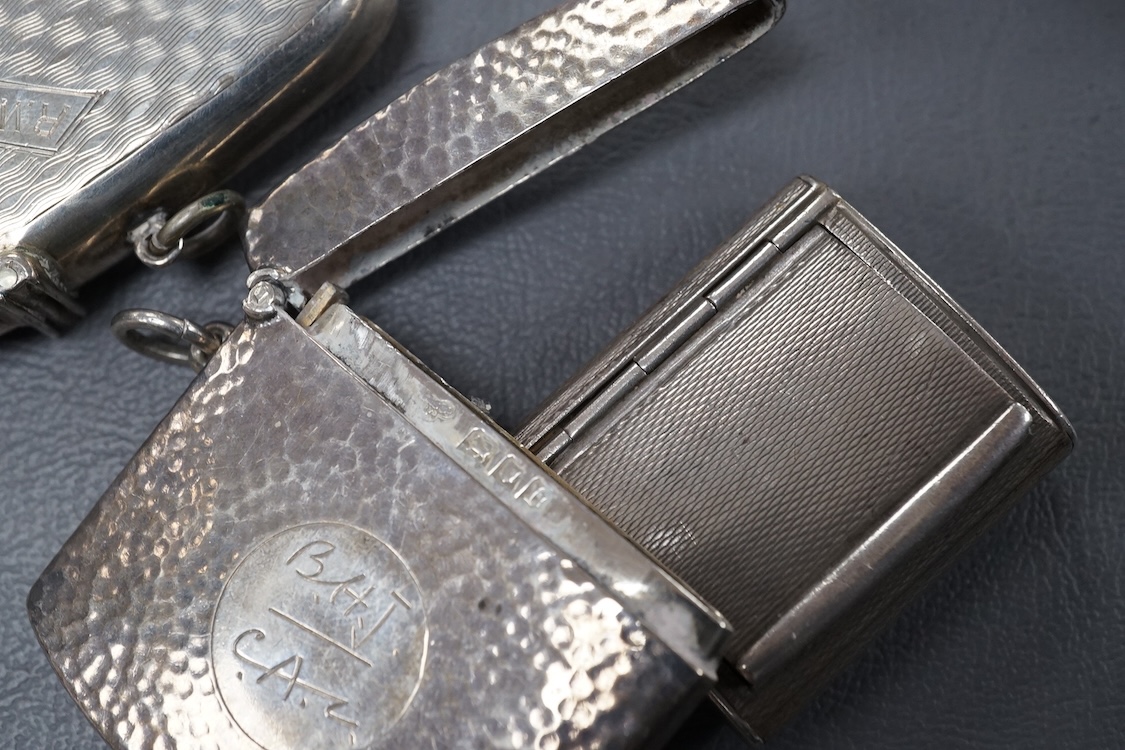 A small group of collectable silver including a George III silver cream jug, London, 1804, height 95mm, three silver vesta cases, two pill boxes, an envelope stamp case, two Georgian toddy ladles, one unmarked, together